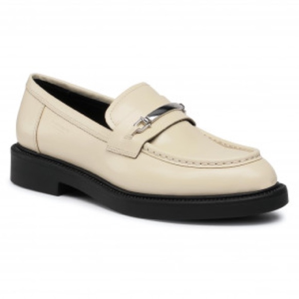 Vagabond penny loafer shoe in cream/ivory with silver embellishment.